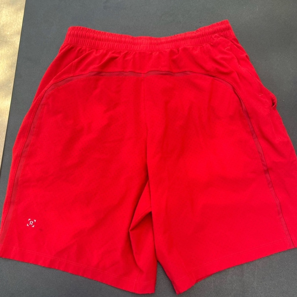 Red Lululemon vented Pace breaker shorts 7”